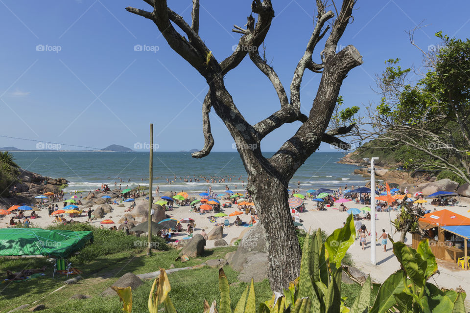 Tourists enjoy the summer on the little beach in Barra da Lagoa in Florianopolis Santa Catarina Brazil.