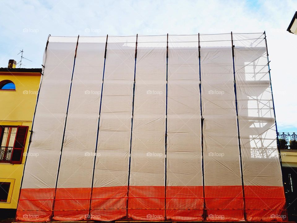 construction scaffold with white tarpaulin