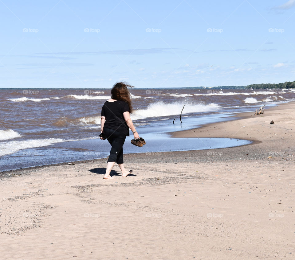 Woman walking on the beach