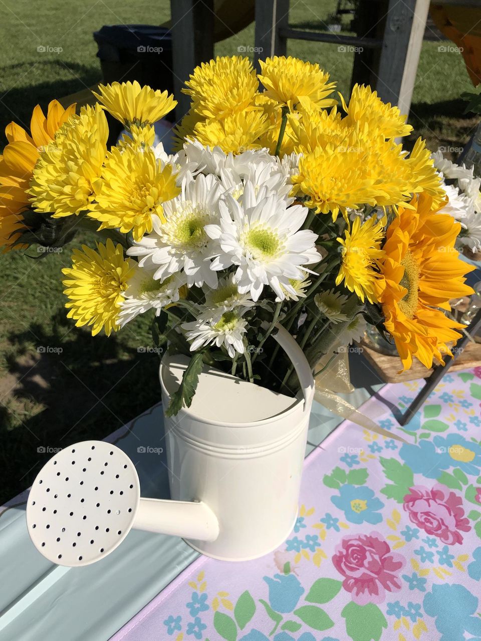 Yellow Flowers in a Watering Can 