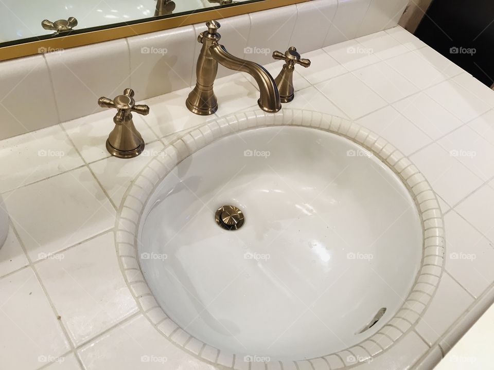 Brass handles sink
