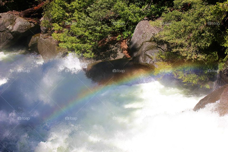 View of rainbow over the river