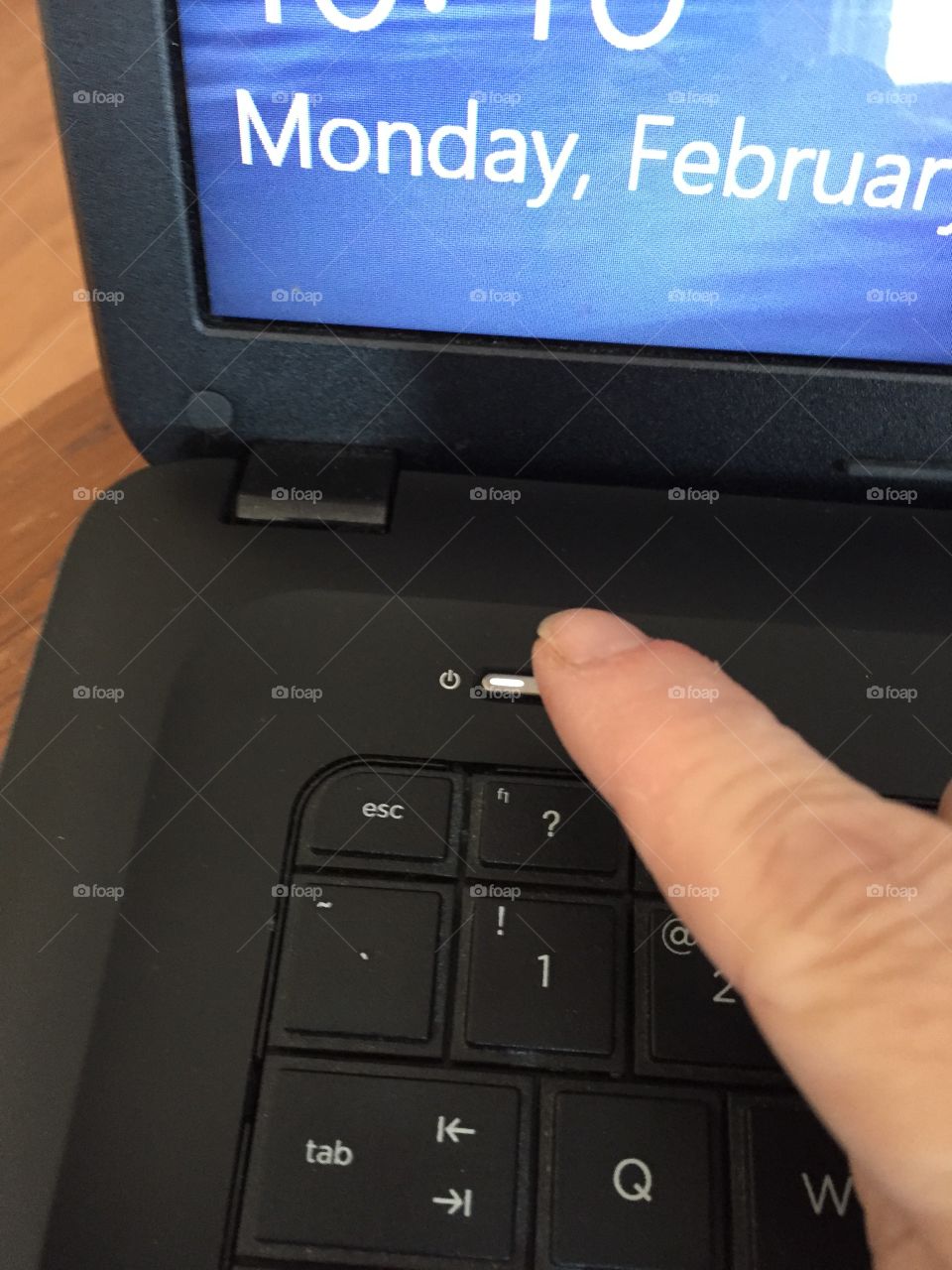 morning ritual of turning on the laptop computer