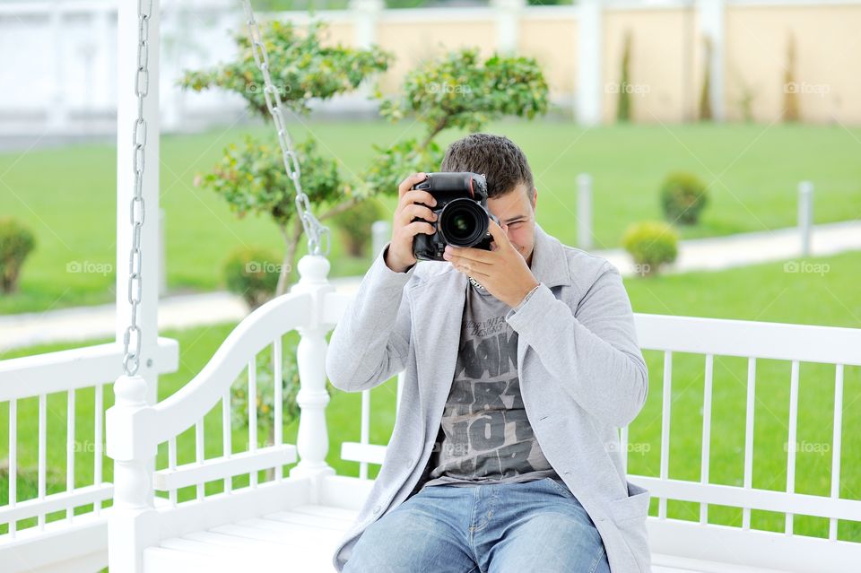 Portrait of a man photographing