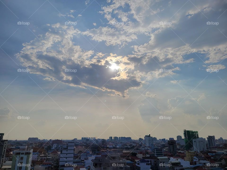 Clouds holding sun Phnom Penh, Cambodia