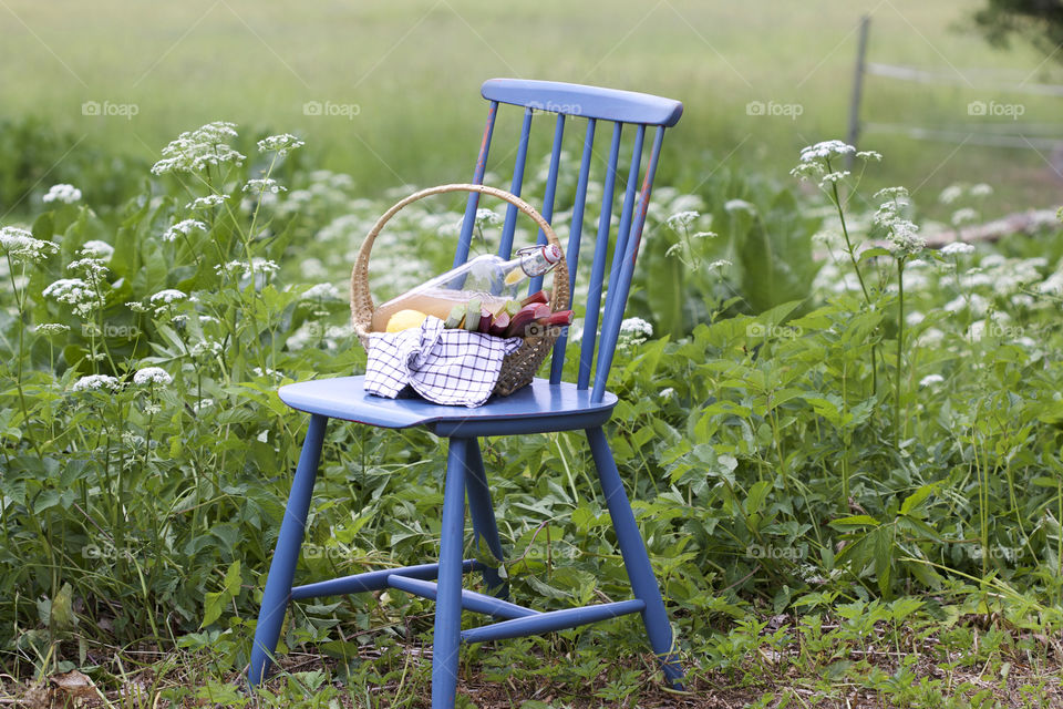 light raspberry juice and blue chair