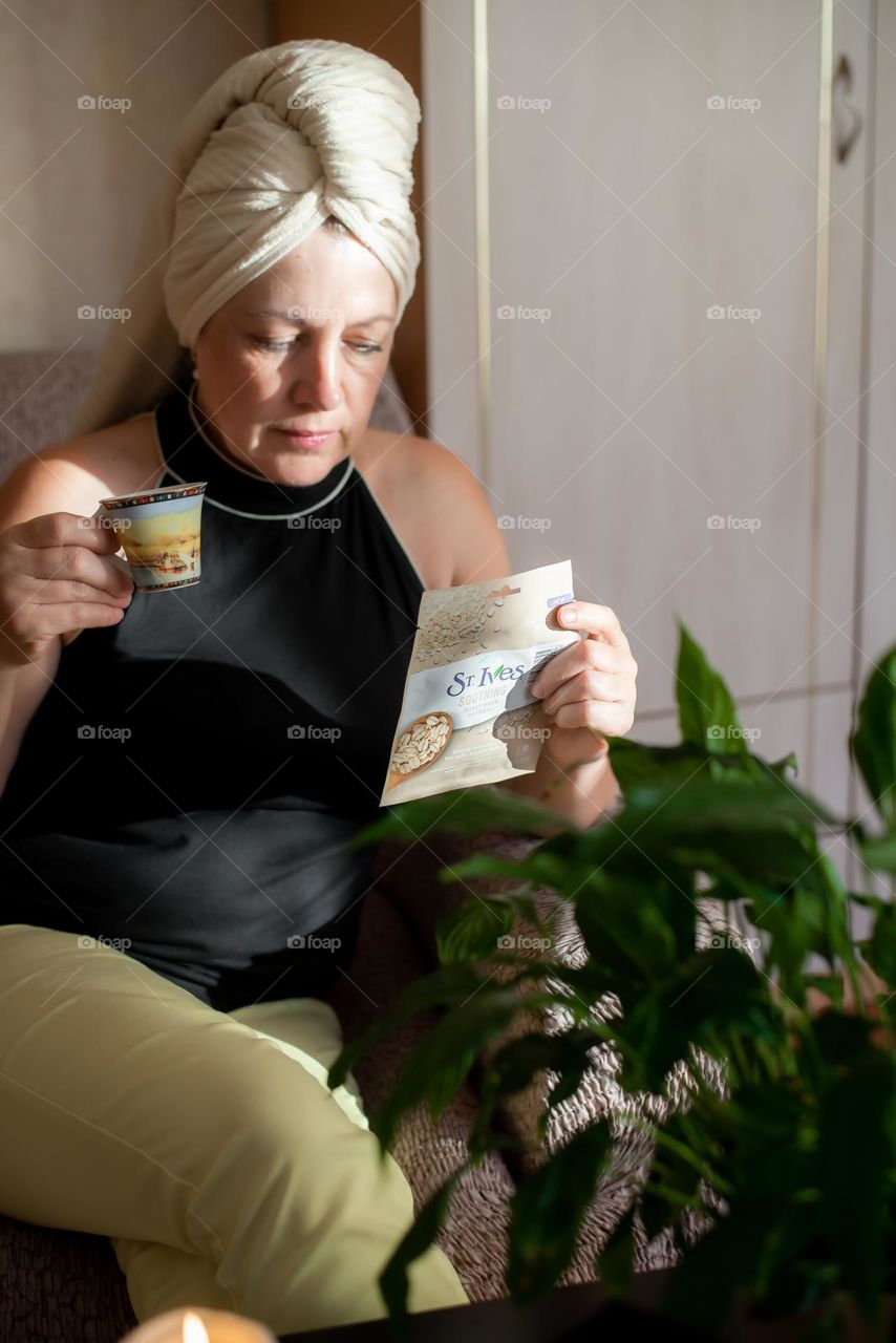 Home beauty salon woman making eye and face mask