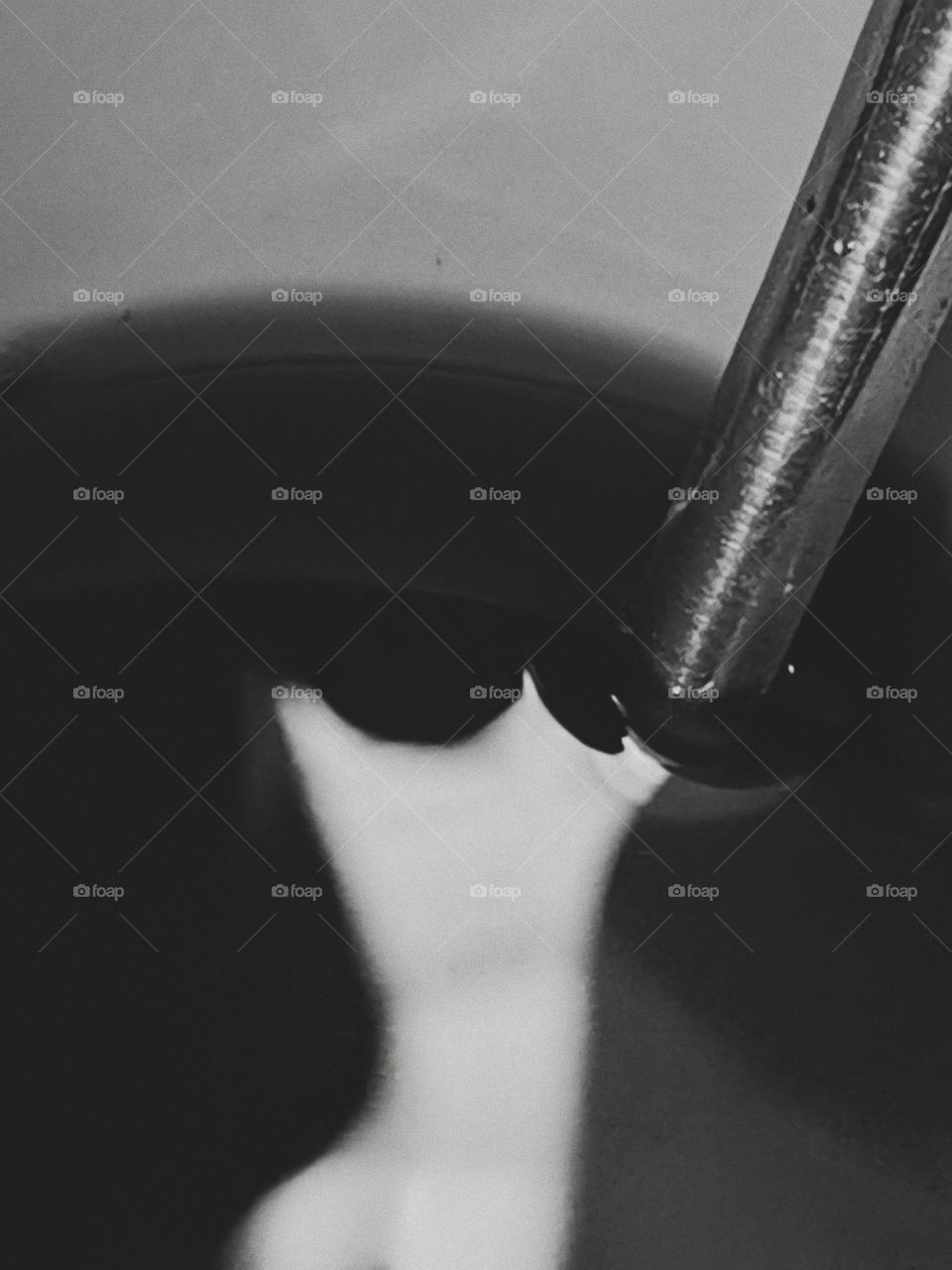 A spoon dipped into coffee