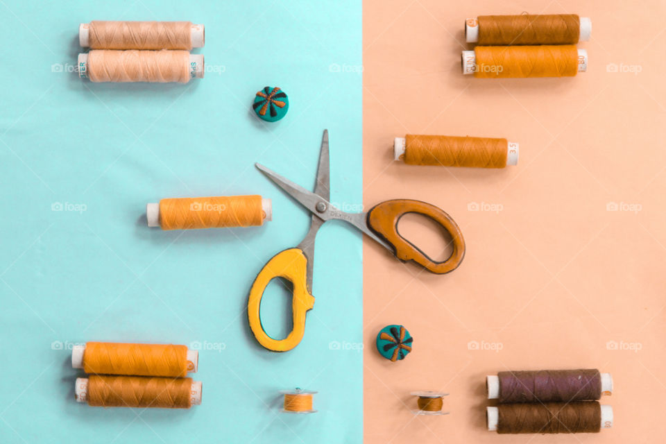 needlework and tailoring concept. scissors, sewing button and spools of thread.flat lay photography,top view.