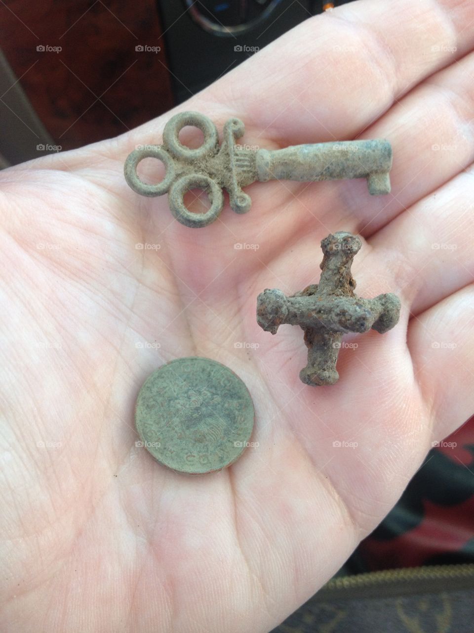 Metal detecting finds. Metal detecting finds from an old park. The finds are an old jax, an old skeleton key, and a Mexican coin.