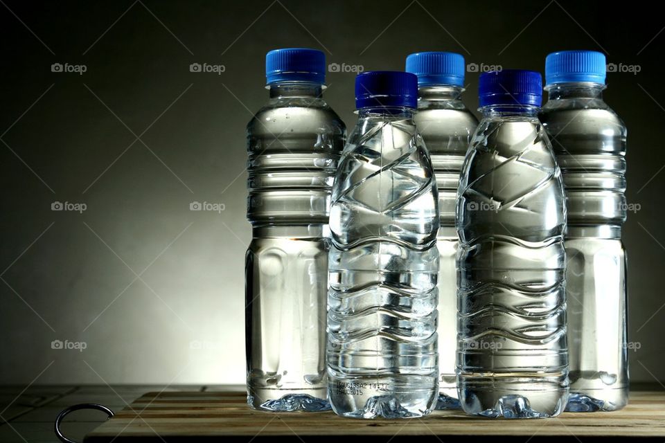 drinking water in different plastic bottles