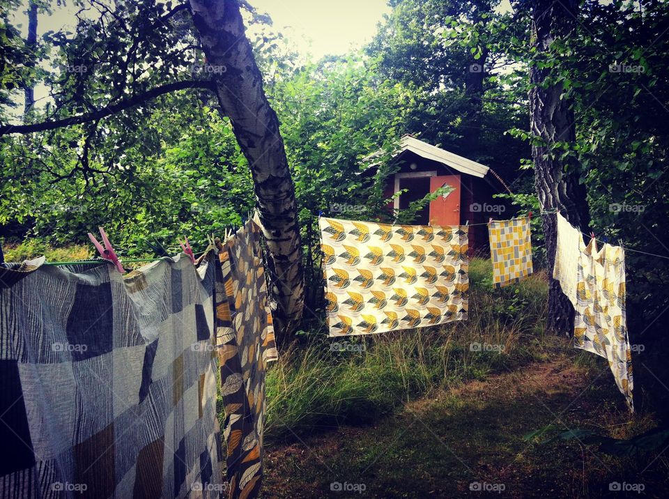 Yellow laundry in green garden