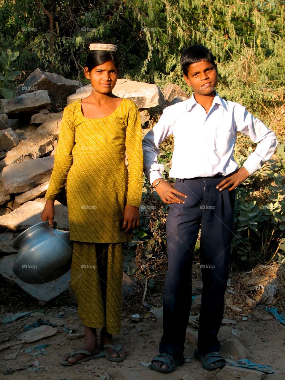 Local children in India. A couple of local youngsters heading to fetch water in India