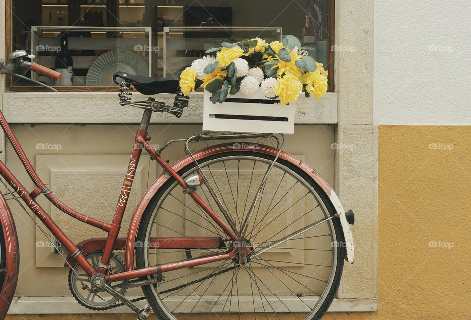 Vintage bicycle with a box of flowers on the back