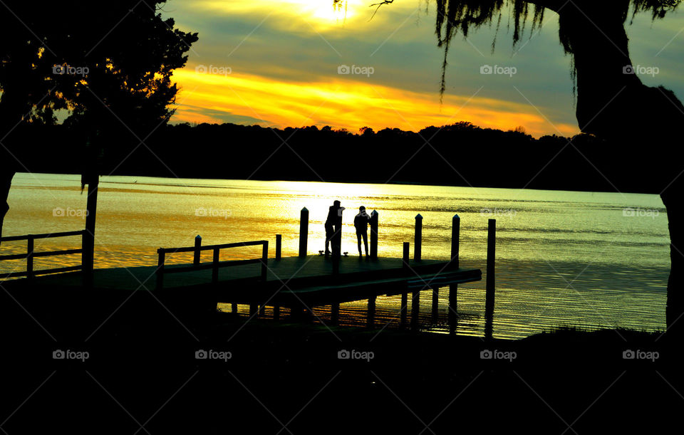 Sun chasers. A group of people watching the golden hour