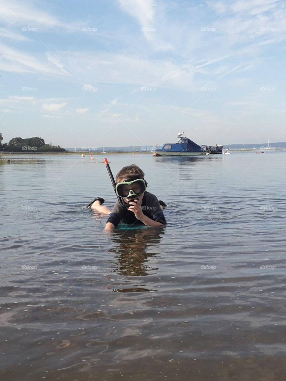 snorkelling child at seaside