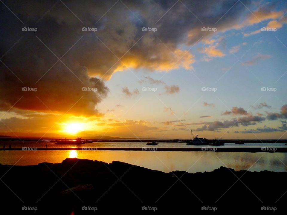 Dramatic sky reflecting on sea