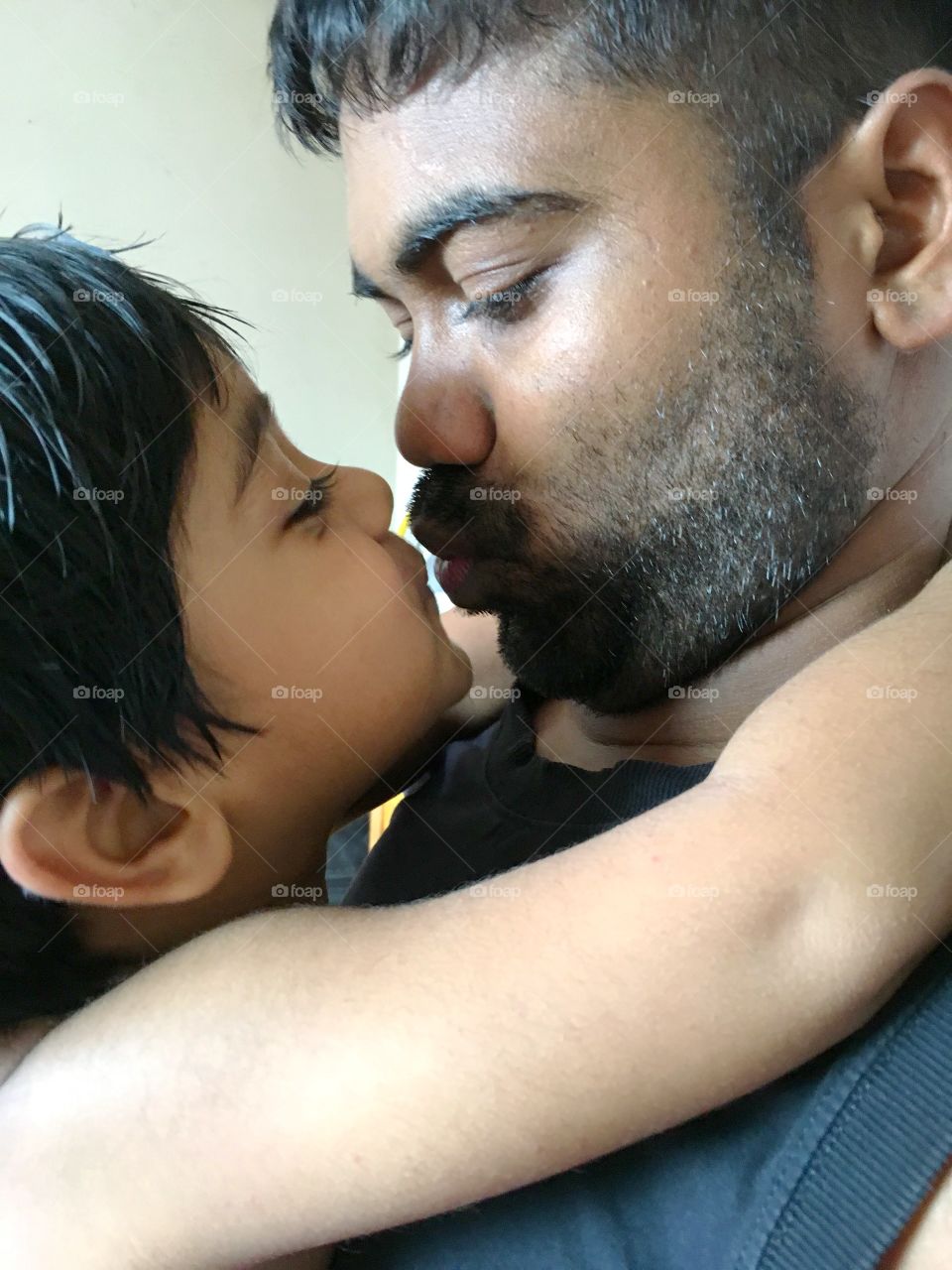 Father son kissing 