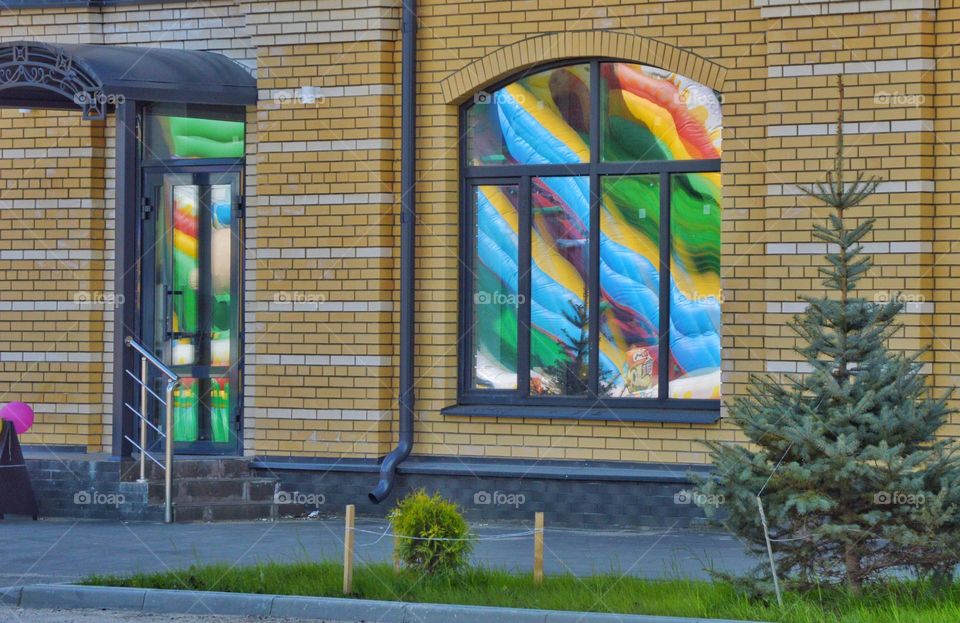 color reflection rainbow in the windows of an apartment building