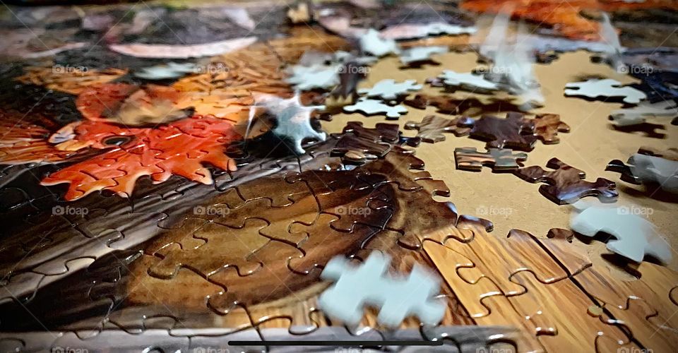 Barn Puzzle, Tan And Brown And Earthly Colors With Pieces Dropping On The Overall Puzzle Being Made.