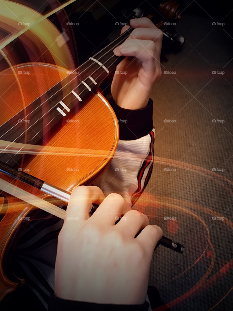 Violinist and light streams