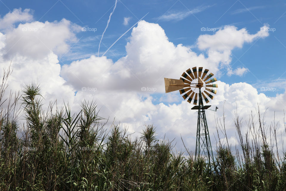 A windmill in a large field