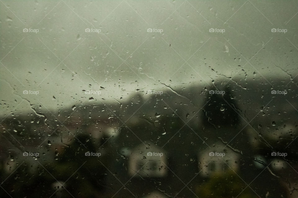 Crying Windows . Rain drops blowing against train window