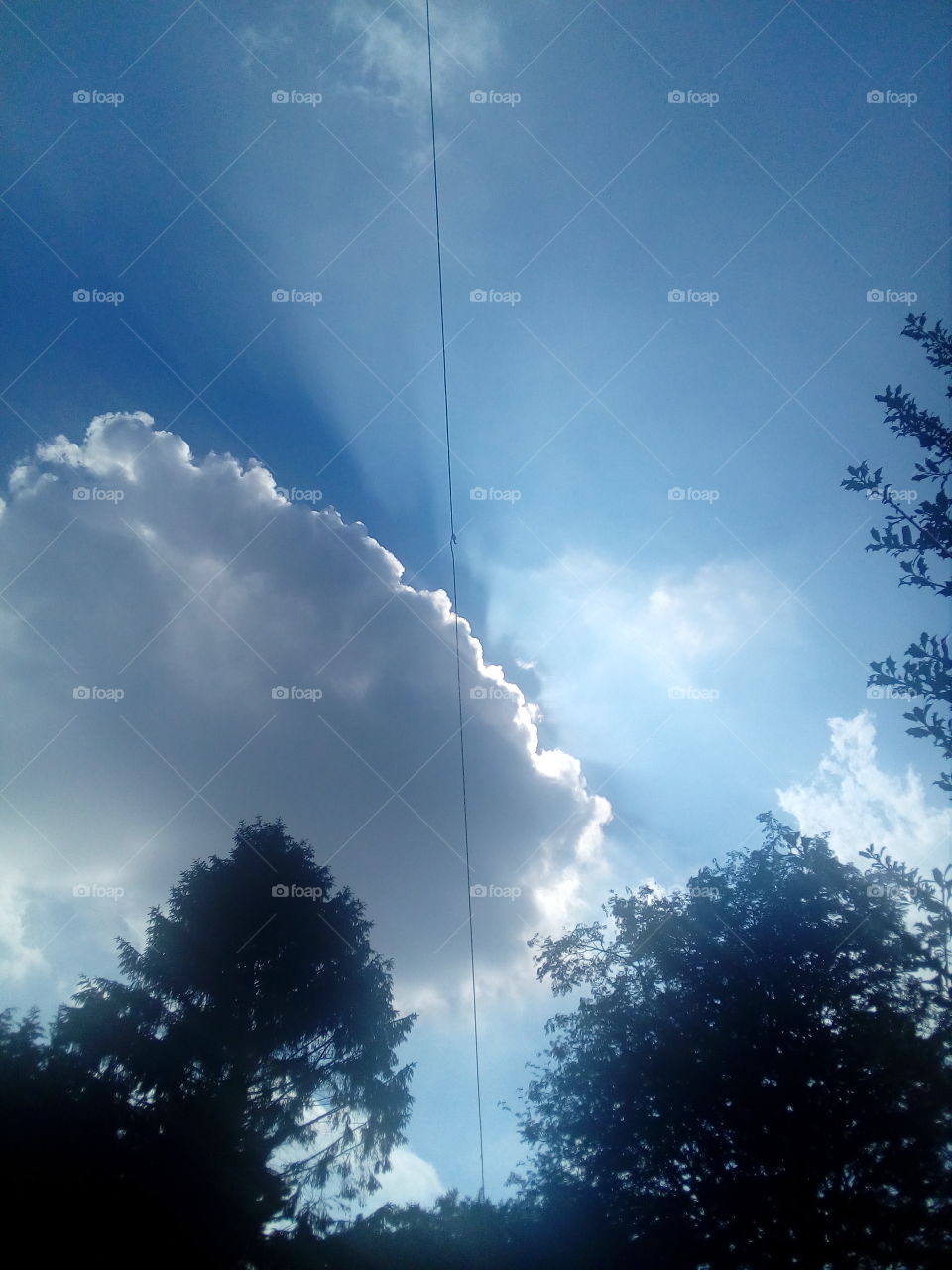 Sun peeping through clouds