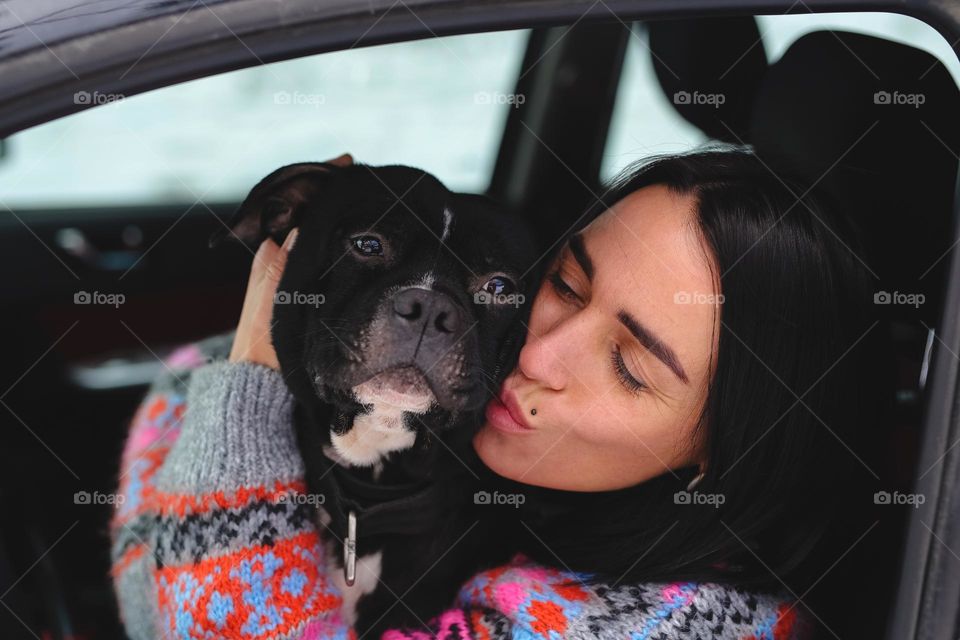 Woman with dog in car 