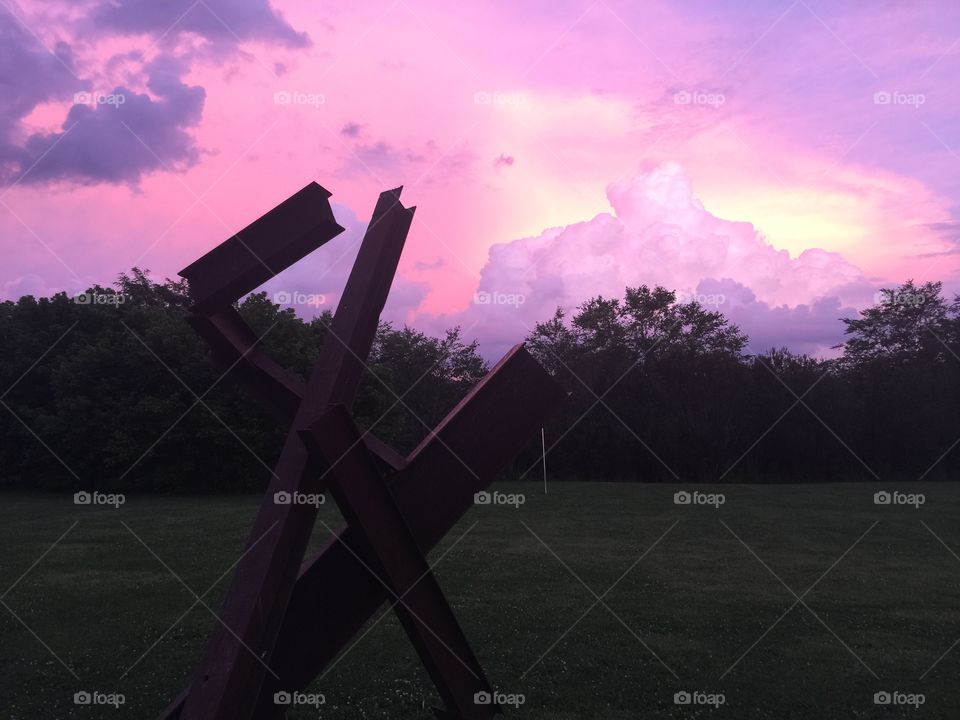 Pink sunset with sculpture