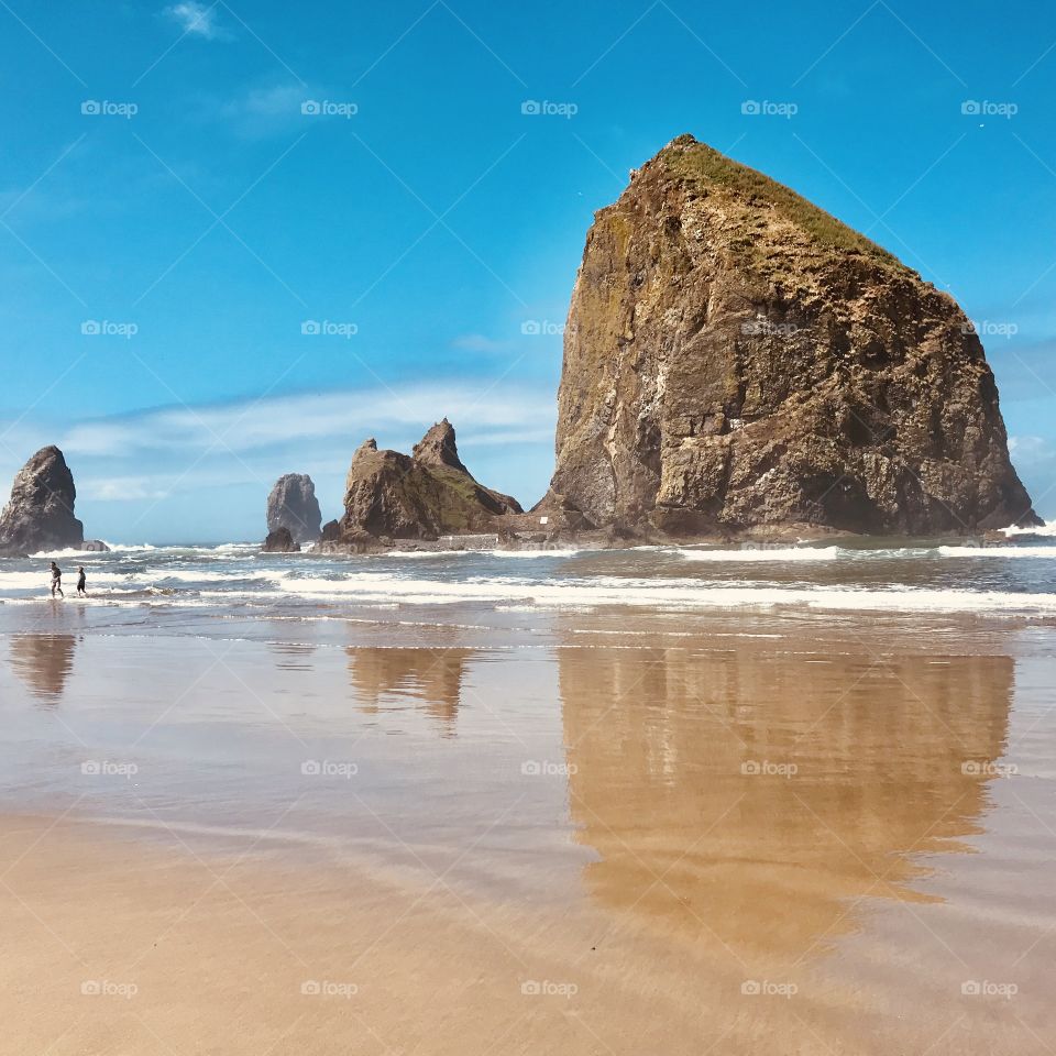 Absolutely stunning famous Haystack Rock in Cannon Beach Oregon makes for beautiful photo of one of America’s most recognizable landscapes! 