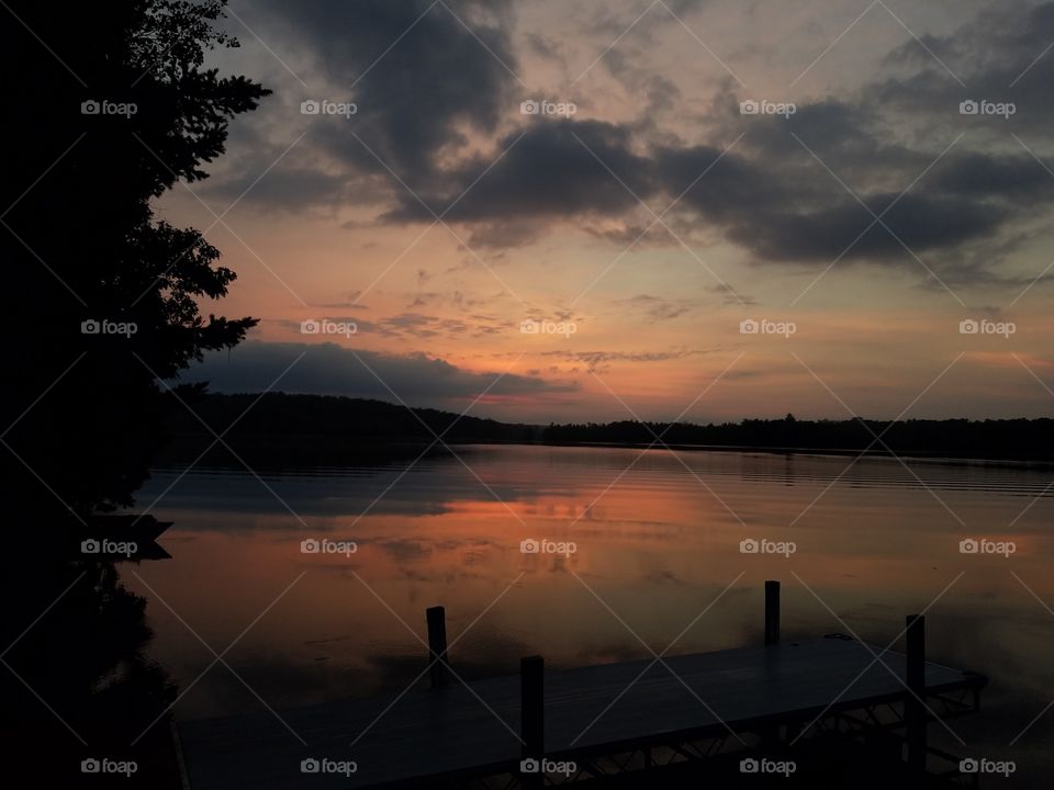 Scenic view of lake at sunrise