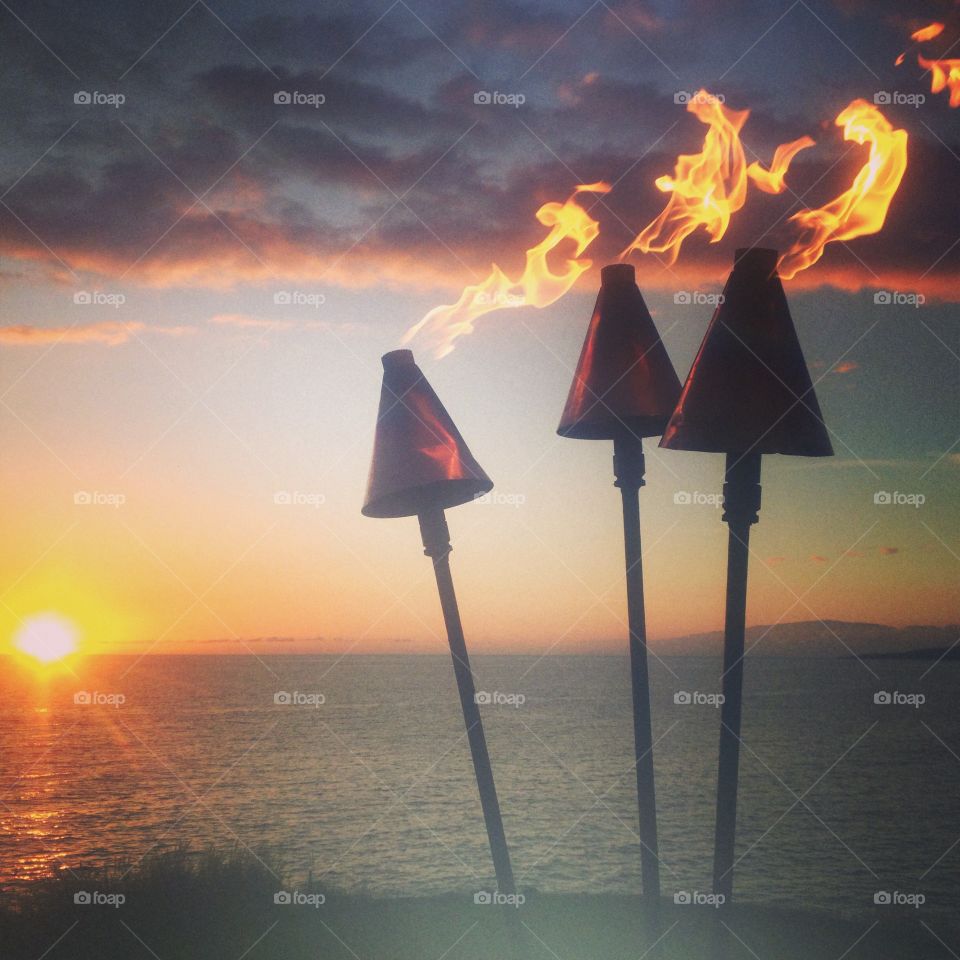 Hawaiian Vacation with Tiki Torches on the Beach
