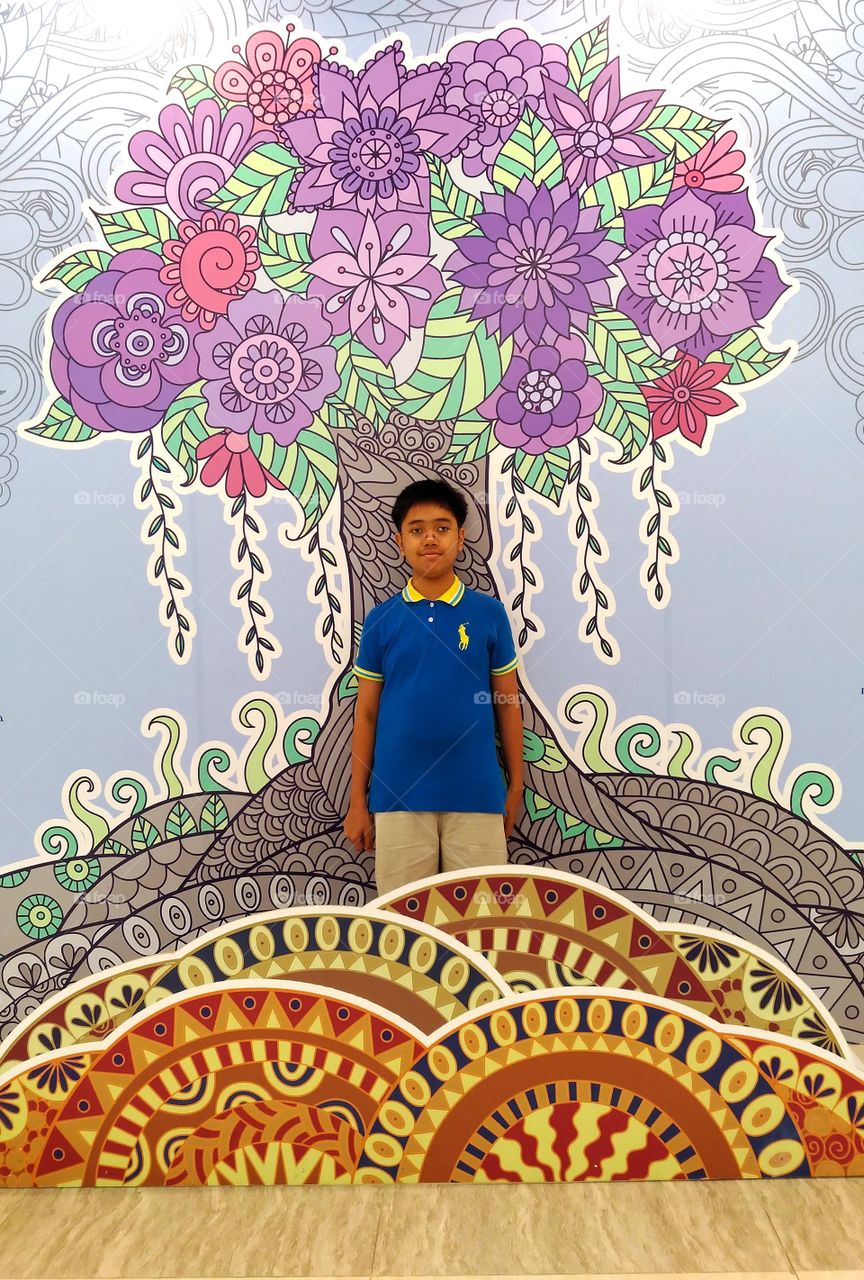 Mandala coloring wall and a boy