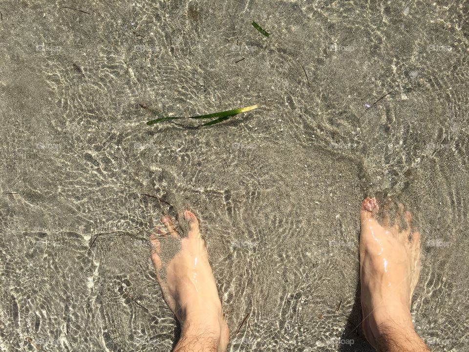 Feet in the sand.