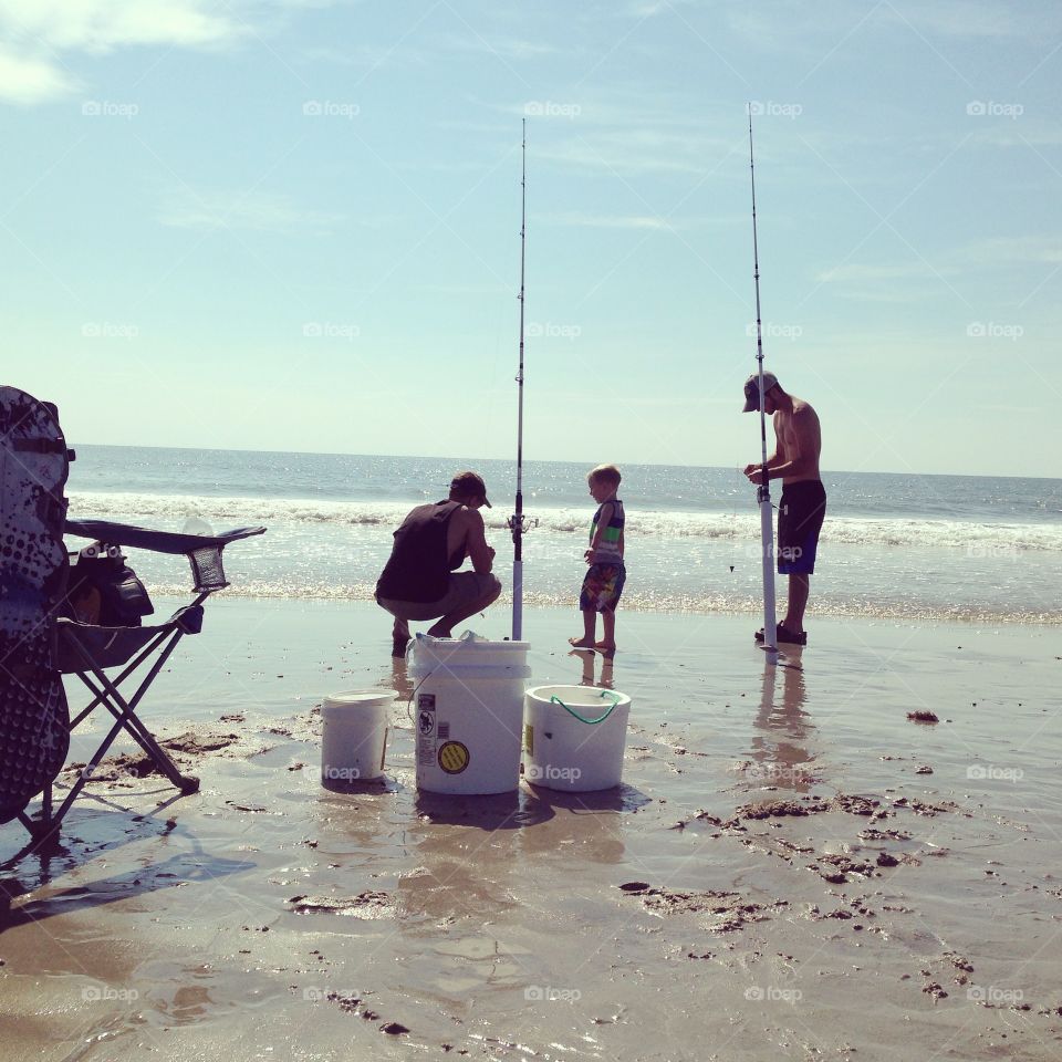 Fishermen . A little fishing to start out a beach day 