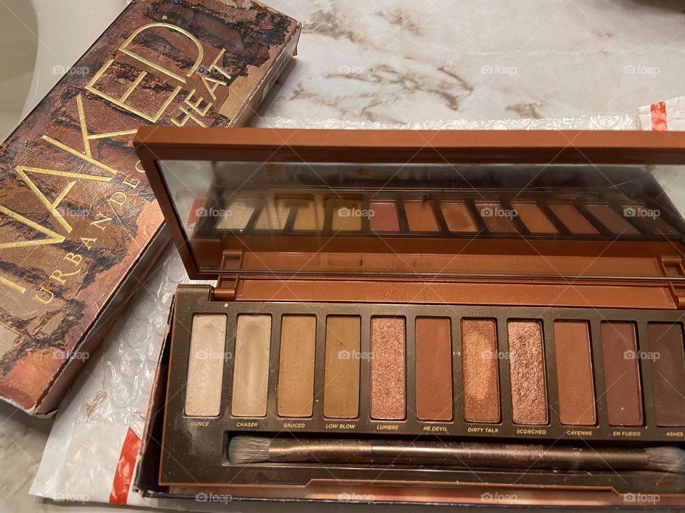 My Urban Decay Eye Shadow compact in Naked Heat. The colors are great for summer, and I use some of them as blush as well. Neutral colors that look good with a tan.