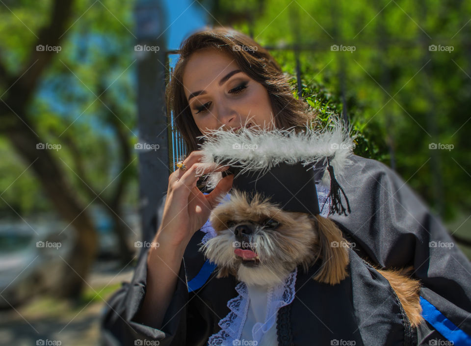 Girl graduating with her dog