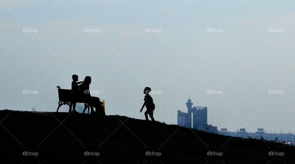 The boy is heading towards his mother.