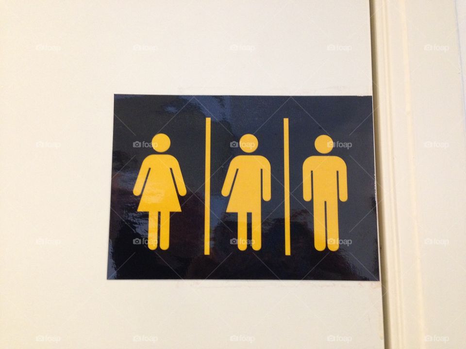 Multi gender toilet, black and yellow icon.