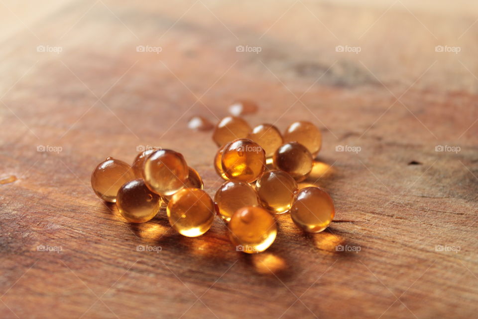 Pills, lights, ice, balls, hand, concrete, pills in hand, beautiful background, glass, round glass, glass balls, LEDs, capsules, bokeh,