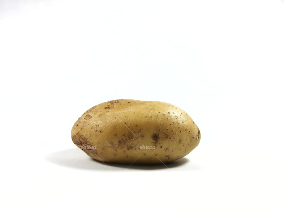 Brown potato isolated on white background