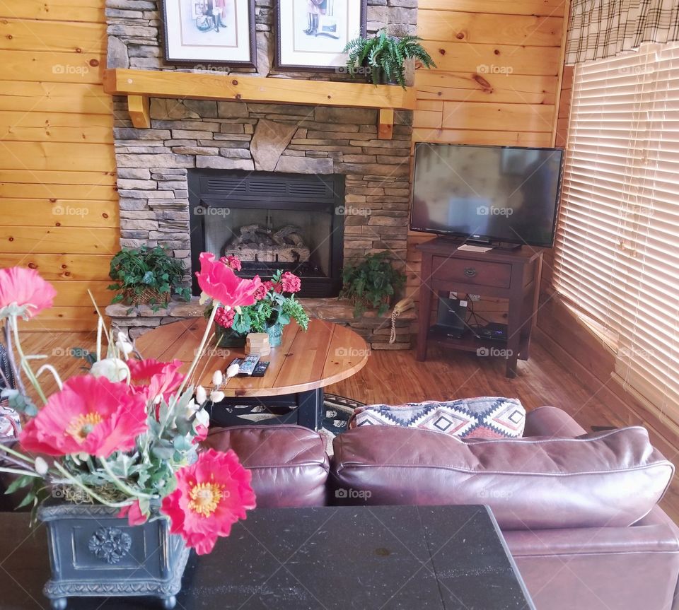 Cozy cabin living to relax by the rustic fireplace, home sweet home.
