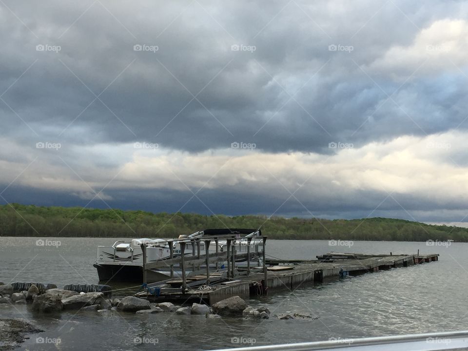 Lake with boat and skyline 

