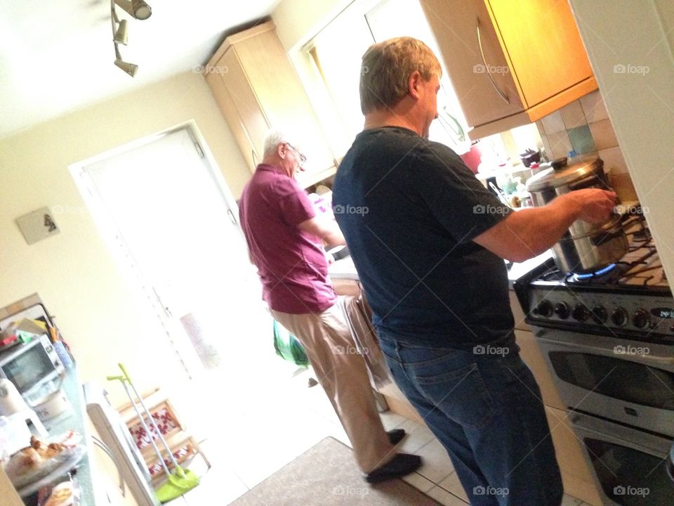 Men cooking the Sunday lunch 