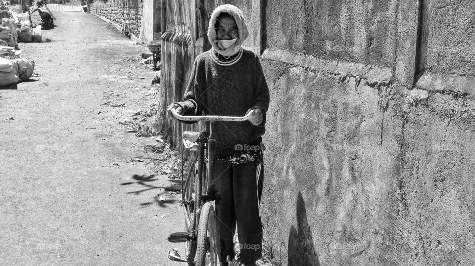 Old lady who spent decades of her life sorting out stones on a nearby beach for the building industry and lately for the tourist industry...