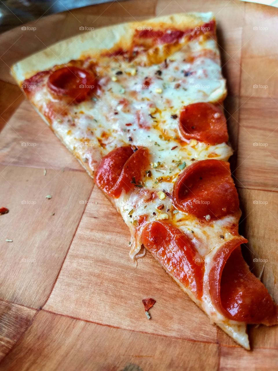 fresh slice of pepperoni pizza