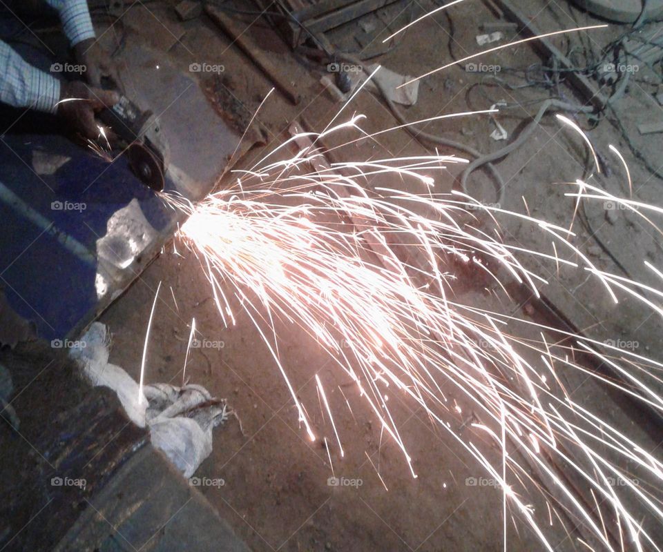 Iron cutting but seeing like a flower beautiful spark