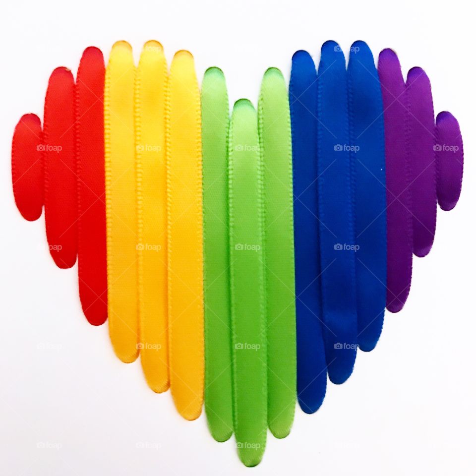 A close up of a rainbow heart made of colorful ribbons to give to the person you truly love!!