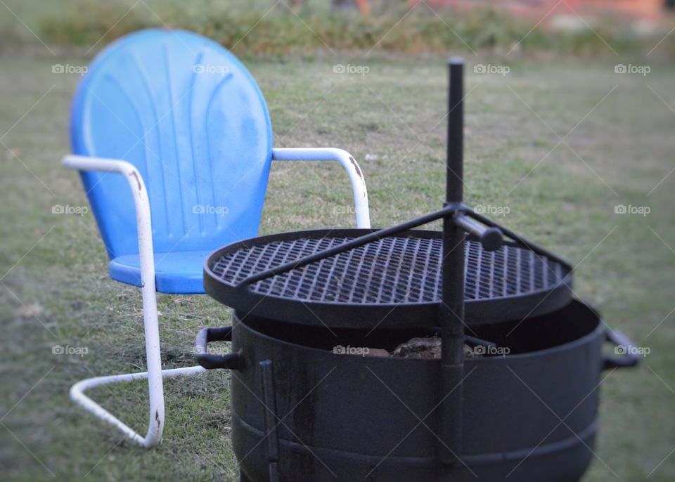 Comfy chair by the grill. 